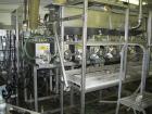 Used Oden Profil 1000 6-Head Inline Volumetric Filler. This unit features six (6) Waukesha Model 15 universal pumps and is currently set up with 1 inch diameter positive shut off nozzles. Pin Indexin...