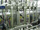 Used Oden Profil 1000 6-Head Inline Volumetric Filler. This unit features six (6) Waukesha Model 15 universal pumps and is currently set up with 1 inch diameter positive shut off nozzles. Pin Indexin...