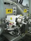 Used Oden Profil 1000 6-Head Inline Volumetric Filler. This unit features six (6) Waukesha Model 15 universal pumps and is currently set up with 1 inch diameter positive shut off nozzles. Pin Indexin...