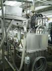 Used Oden Profil 1000 6-Head Inline Volumetric Filler. This unit features six (6) Waukesha Model 15 universal pumps and is currently set up with 1 inch diameter positive shut off nozzles. Pin Indexin...