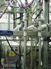 Used Oden Profil 1000 6-Head Inline Volumetric Filler. This unit features six (6) Waukesha Model 15 universal pumps and is currently set up with 1 inch diameter positive shut off nozzles. Pin Indexin...