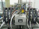 Used Oden Profil 1000 6-Head Inline Volumetric Filler. This unit features six (6) Waukesha Model 15 universal pumps and is currently set up with 1 inch diameter positive shut off nozzles. Pin Indexin...