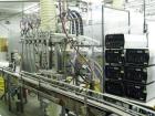 Used Oden Profil 1000 6-Head Inline Volumetric Filler. This unit features six (6) Waukesha Model 15 universal pumps and is currently set up with 1 inch diameter positive shut off nozzles. Pin Indexin...