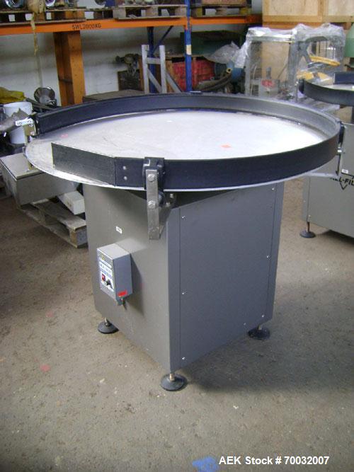 Used All-Fill Dual Head Automatic Container / Tub Filling Line. Line consists of: 48" diameter unscrambling feed disc, All Fill model DHA dual head auger filler with 10 gallon (38 liter) agitated hop...