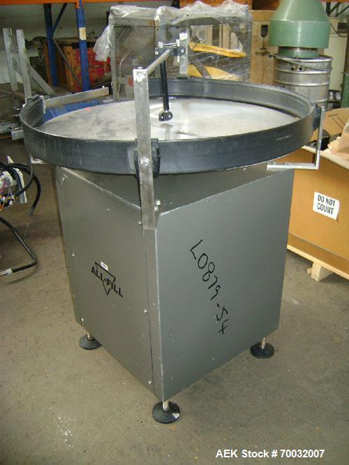 Used All-Fill Dual Head Automatic Container / Tub Filling Line. Line consists of: 48" diameter unscrambling feed disc, All Fill model DHA dual head auger filler with 10 gallon (38 liter) agitated hop...