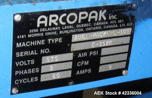 Used Arcopak Auger Bag Packer, Model Augerpack ERC-1010. Agitated feed hopper, carbon steel spout, stainless steel auger, 5 hp, 575 volt motor.