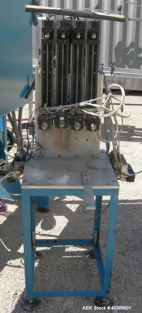 Used Image 4000 Quad Four Head Inline Auger Filling System. Each fillerhas a 22" diameter, 16 gallon, stainless steel agitated hopper. Has 6" diameter charge port on stainless steel cover with inspec...