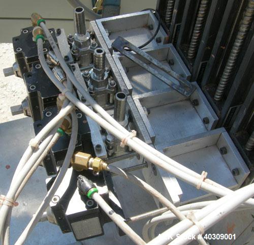 Used Image 4000 Quad Four Head Inline Auger Filling System. Each fillerhas a 22" diameter, 16 gallon, stainless steel agitated hopper. Has 6" diameter charge port on stainless steel cover with inspec...