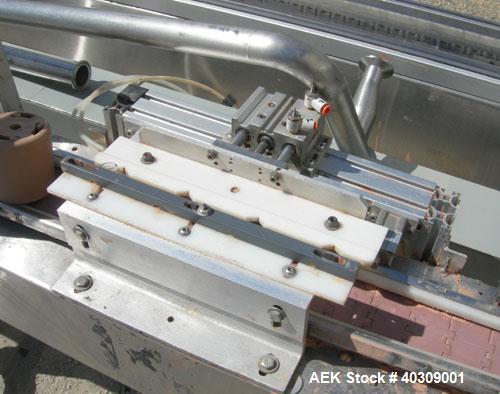 Used Image 4000 Quad Four Head Inline Auger Filling System. Each fillerhas a 22" diameter, 16 gallon, stainless steel agitated hopper. Has 6" diameter charge port on stainless steel cover with inspec...