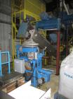 Used Arcopak Auger Bag Packer, Model Augerpack ERC-1010. Agitated feed hopper, carbon steel spout, stainless steel auger, 5 hp, 575 volt motor.
