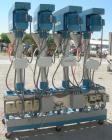 Used Image 4000 Quad Four Head Inline Auger Filling System. Each fillerhas a 22