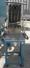 Used Image 4000 Quad Four Head Inline Auger Filling System. Each fillerhas a 22