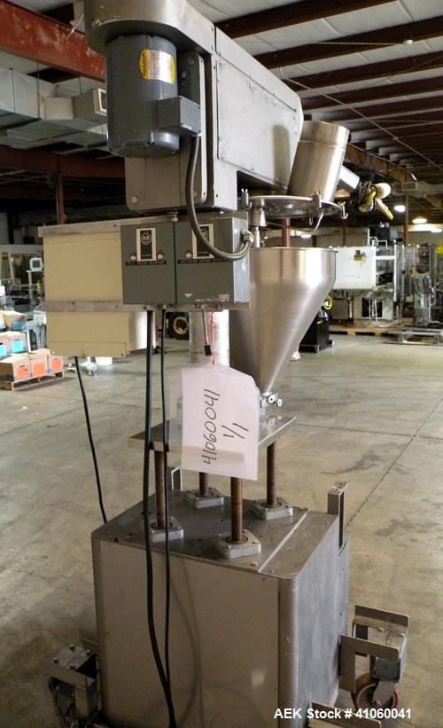Used All-Fill Single Auger Filler, Model B, stainless steel. Auger model # AF40, 3-1/2" diameter tapered down to 2" at the bottom. Approximately 22" diameter hopper with dust cover. Set up for non-fr...