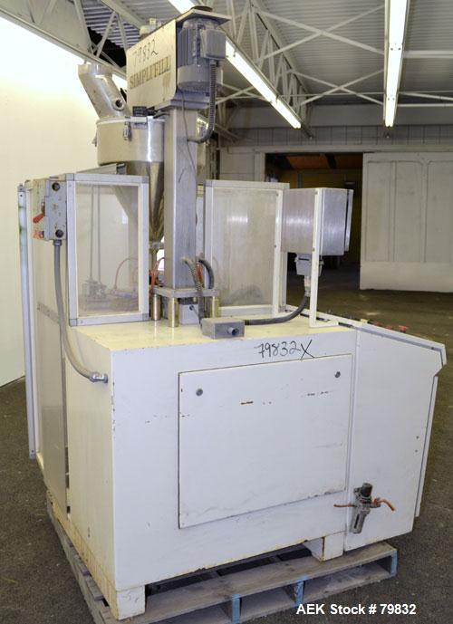 Used Curtis Packaging Machinery Service Model Simpli Fill Powder Auger-Filler. 18" Diameter x 6-1/2" straight side x 14" cone hopper with side scrapers and auger. Driven by .5hp motor, 6" wide x 39" ...
