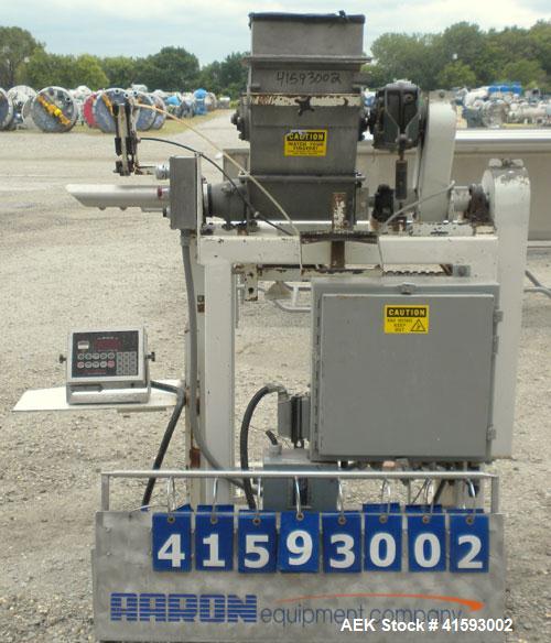 Used Single Auger Bag Packer, stainless steel. 12" x 14" feed hopper with a 12" diameter lump breaker, 2 1/2" diameter bottom screw. Driven by a 3/1.5 hp, 3/60/208-230 volt, 1725/850 rpm motor thru D...