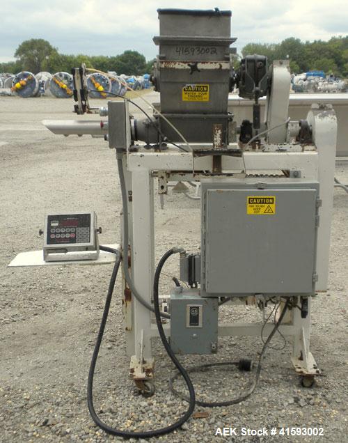 Used Single Auger Bag Packer, stainless steel. 12" x 14" feed hopper with a 12" diameter lump breaker, 2 1/2" diameter bottom screw. Driven by a 3/1.5 hp, 3/60/208-230 volt, 1725/850 rpm motor thru D...