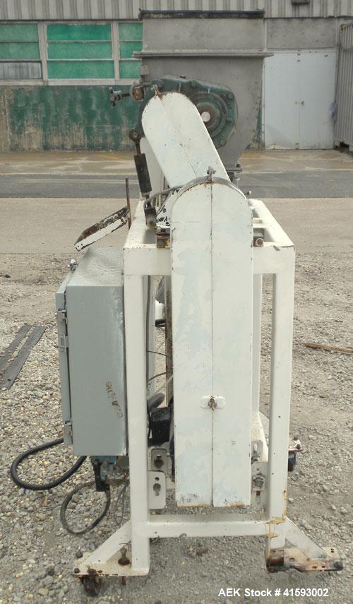 Used Single Auger Bag Packer, stainless steel. 12" x 14" feed hopper with a 12" diameter lump breaker, 2 1/2" diameter bottom screw. Driven by a 3/1.5 hp, 3/60/208-230 volt, 1725/850 rpm motor thru D...
