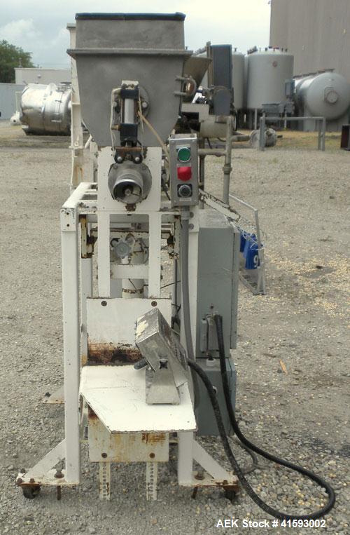 Used Single Auger Bag Packer, stainless steel. 12" x 14" feed hopper with a 12" diameter lump breaker, 2 1/2" diameter bottom screw. Driven by a 3/1.5 hp, 3/60/208-230 volt, 1725/850 rpm motor thru D...