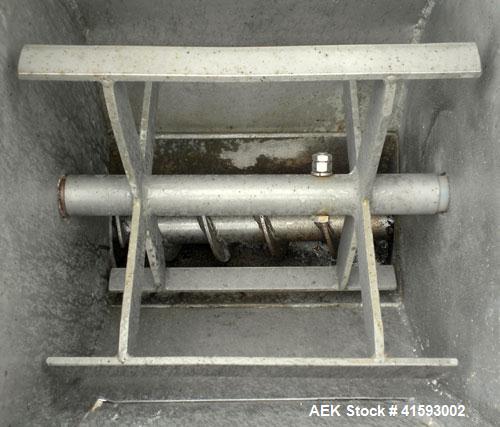 Used Single Auger Bag Packer, stainless steel. 12" x 14" feed hopper with a 12" diameter lump breaker, 2 1/2" diameter bottom screw. Driven by a 3/1.5 hp, 3/60/208-230 volt, 1725/850 rpm motor thru D...