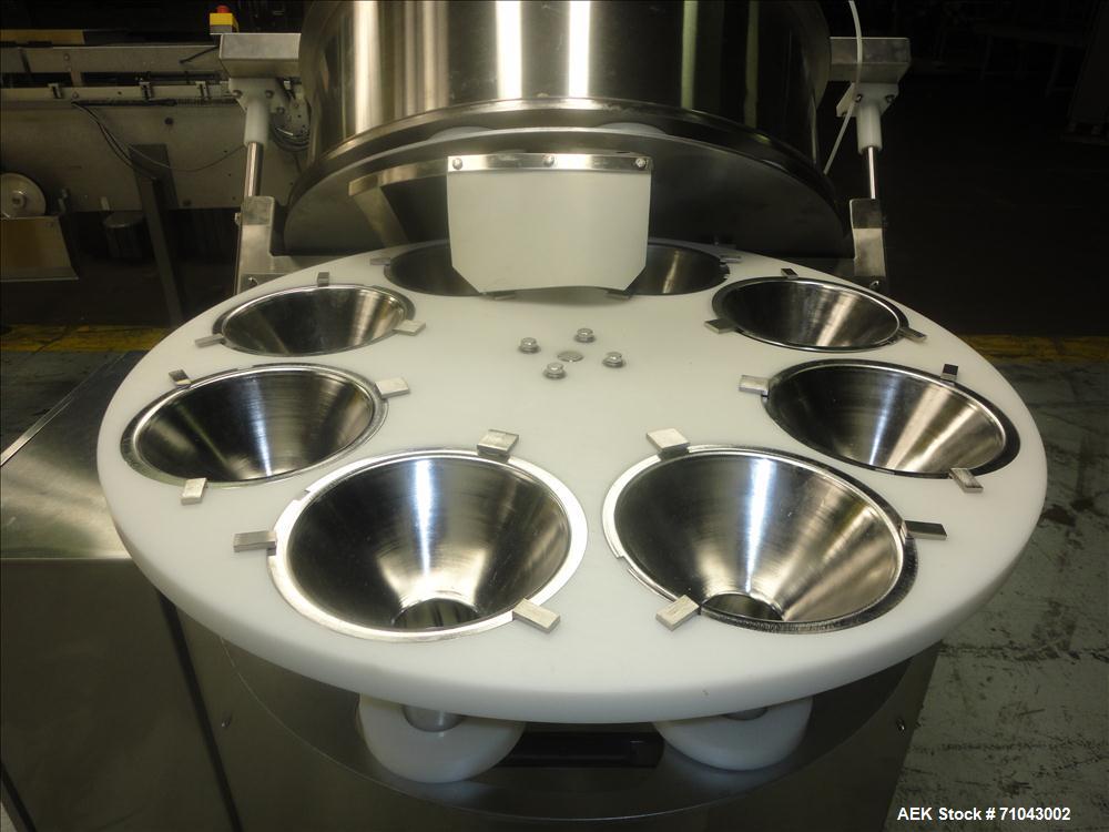 Used FEMC Model 1134 Angular Dial Volumetric Filler. Machine is capable of speeds up to 160 containers per minute. Hopper capacity: 1200 cubic inch. Product dispensing volume up to 50 cubic inch. Des...