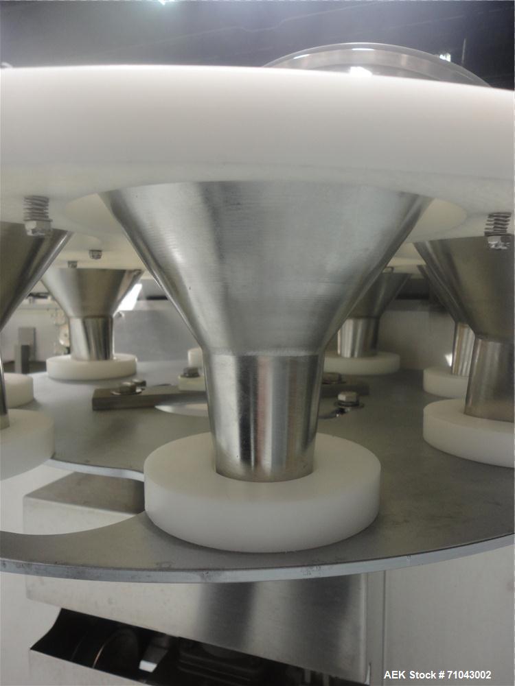 Used FEMC Model 1134 Angular Dial Volumetric Filler. Machine is capable of speeds up to 160 containers per minute. Hopper capacity: 1200 cubic inch. Product dispensing volume up to 50 cubic inch. Des...