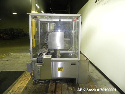 Used M&O Perry Model E1200 Vacuum Powder Filler. Capable of speeds up to 150 vial containers per minute. Container size range: (Diam) .75" to 2.06" (Height) 1" to 5.75". Includes Allen Bradley PLC co...