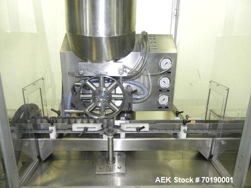 Used M&O Perry Model E1200 Vacuum Powder Filler. Capable of speeds up to 150 vial containers per minute. Container size range: (Diam) .75" to 2.06" (Height) 1" to 5.75". Includes Allen Bradley PLC co...
