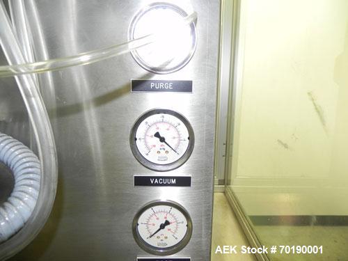 Used M&O Perry Model E1200 Vacuum Powder Filler. Capable of speeds up to 150 vial containers per minute. Container size range: (Diam) .75" to 2.06" (Height) 1" to 5.75". Includes Allen Bradley PLC co...