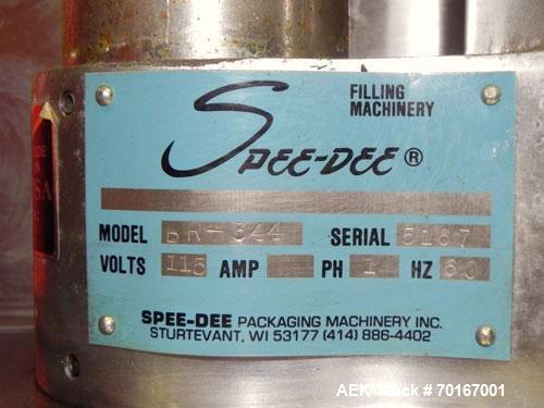 Used Spee-Dee BR-344 Volumetric Cup Filler. Capable of speeds up to 80 fills per minute. Has a 1.5 cubic foot stainless steel hopper. Cup size: diameter 4", length .62" to 12" with changeparts. Clutc...