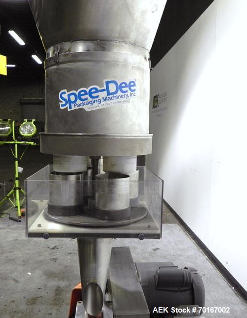 Used Spee-Dee BR-344 Volumetric Cup Filler. Capable of speeds up to 80 fills per minute. Has a 1.5 cubic foot stainless steel hopper. Cup size: diameter 4", length .62" to 12" with changeparts. Clutc...