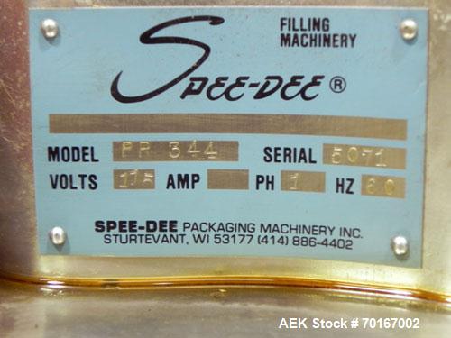 Used Spee-Dee BR-344 Volumetric Cup Filler. Capable of speeds up to 80 fills per minute. Has a 1.5 cubic foot stainless steel hopper. Cup size: diameter 4", length .62" to 12" with changeparts. Clutc...