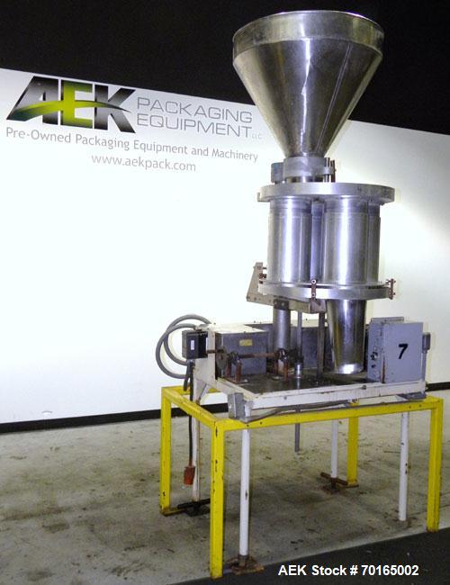 Used Spee-Dee Model KRE-468 4-Pocket Volumetric Cup Filler. Fixed speed 30 per minute. Has (4) 8" diameter 13" tall cup plates with a 4" vertical top plate adjustment. Machine has a 5.6 cubic foot st...