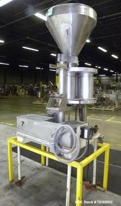 Used Spee-Dee Model KRE-468 4-Pocket Volumetric Cup Filler. Fixed speed 30 per minute. Has (4) 8" diameter 13" tall cup plates with a 4" vertical top plate adjustment. Machine has a 5.6 cubic foot st...