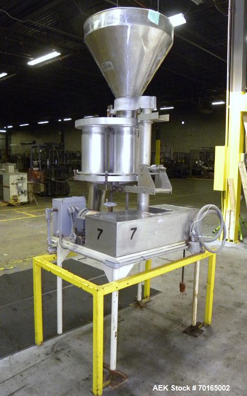 Used Spee-Dee Model KRE-468 4-Pocket Volumetric Cup Filler. Fixed speed 30 per minute. Has (4) 8" diameter 13" tall cup plates with a 4" vertical top plate adjustment. Machine has a 5.6 cubic foot st...
