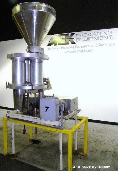 Used Spee-Dee Model KRE-468 4-Pocket Volumetric Cup Filler. Fixed speed 30 per minute. Has (4) 8" diameter 13" tall cup plates with a 4" vertical top plate adjustment. Machine has a 5.6 cubic foot st...