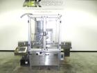 Used M&O Perry Model E1200 Vacuum Powder Filler. Capable of speeds up to 150 vial containers per minute. Container size range: (Diam) .75