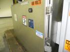 Used M&O Perry Model E1200 Vacuum Powder Filler. Capable of speeds up to 150 vial containers per minute. Container size range: (Diam) .75