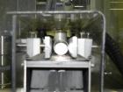 Used M&O Perry Model E1200 Vacuum Powder Filler. Capable of speeds up to 150 vial containers per minute. Container size range: (Diam) .75
