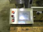 Used M&O Perry Model E1200 Vacuum Powder Filler. Capable of speeds up to 150 vial containers per minute. Container size range: (Diam) .75