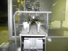 Used M&O Perry Model E1200 Vacuum Powder Filler. Capable of speeds up to 150 vial containers per minute. Container size range: (Diam) .75