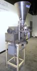 Used- Spee-Dee 4-Pocket Volumetric Cup Filler. Has approximately (4) 2