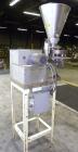 Used- Spee-Dee 4-Pocket Volumetric Cup Filler. Has approximately (4) 2