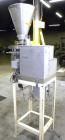 Used Spee-Dee 4-Pocket Volumetric Cup Filler. Has approximately (4) 2