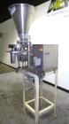 Used Spee-Dee 4-Pocket Volumetric Cup Filler. Has approximately (4) 2