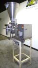 Used- Spee-Dee 4-Pocket Volumetric Cup Filler. Has approximately (4) 2