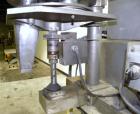 Used- Spee-Dee 4-Pocket Volumetric Cup Filler. Has approximately (4) 2