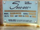 Used Spee-Dee BR-344 Volumetric Cup Filler. Capable of speeds up to 80 fills per minute. Has a 1.5 cubic foot stainless steel hopper. Cup size: diameter 4