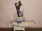 Used Spee-Dee Automatic Volumetric Cup Filler, Model CB4. Has 4 pockets with a dual discharge. Cup size range: diameter 1
