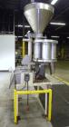 Used Spee-Dee Model KRE-468 4-Pocket Volumetric Cup Filler. Fixed speed 30 per minute. Has (4) 8