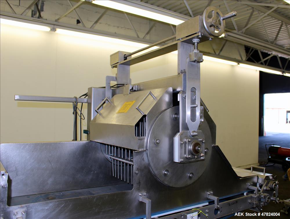 Used Waterfall Cheese/Applicator for Pizza, 304 Stainless Steel. Has 28" wide x 60" long belt conveyor driven by a 1/2hp, 3/60/208-230/460 volt, 1725 rpm washguard gear motor (no ratio). Approximate ...